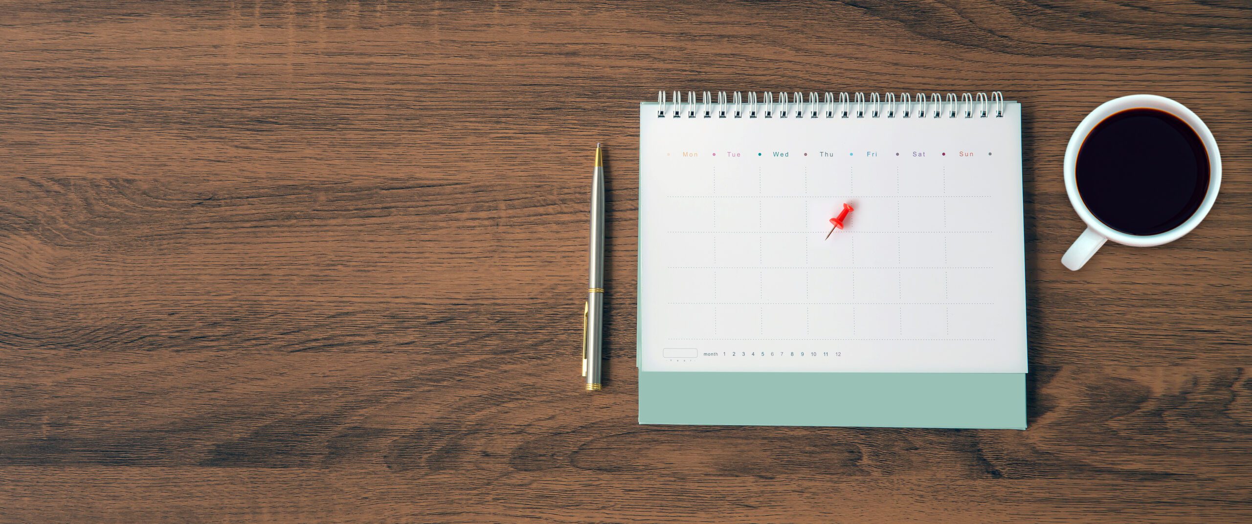 The Top View Desk And Blank Calendar With A Pen And Office Equip